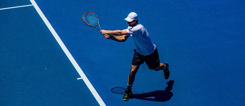tennis player on court playing